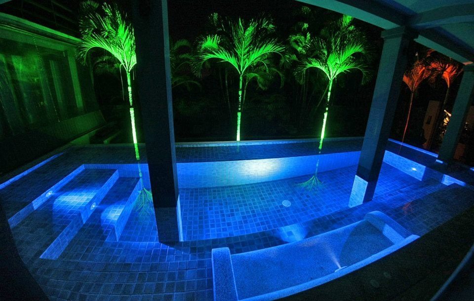Courtyard pool lit at night, Siam