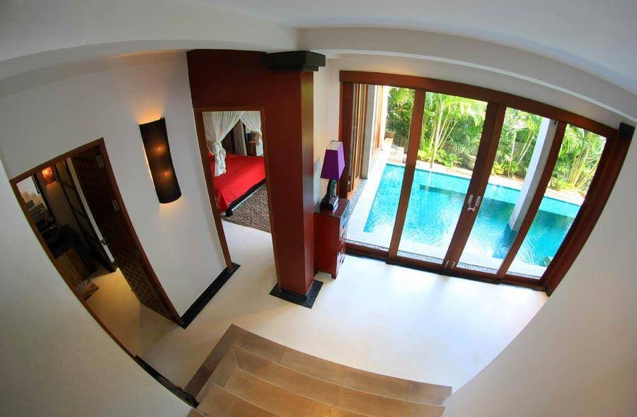 Stairwell overlooking courtyard pool, Siam