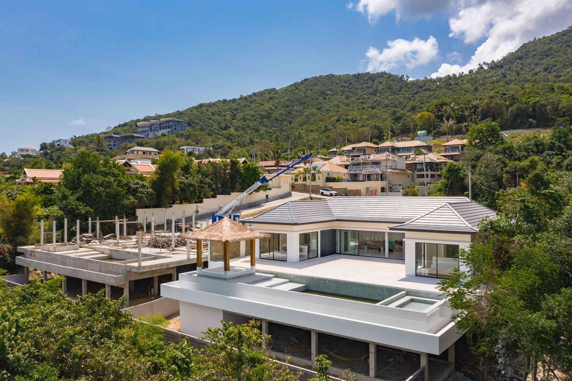 Aerial view of a HAMPKON hillside villa cluster, Koh Samui