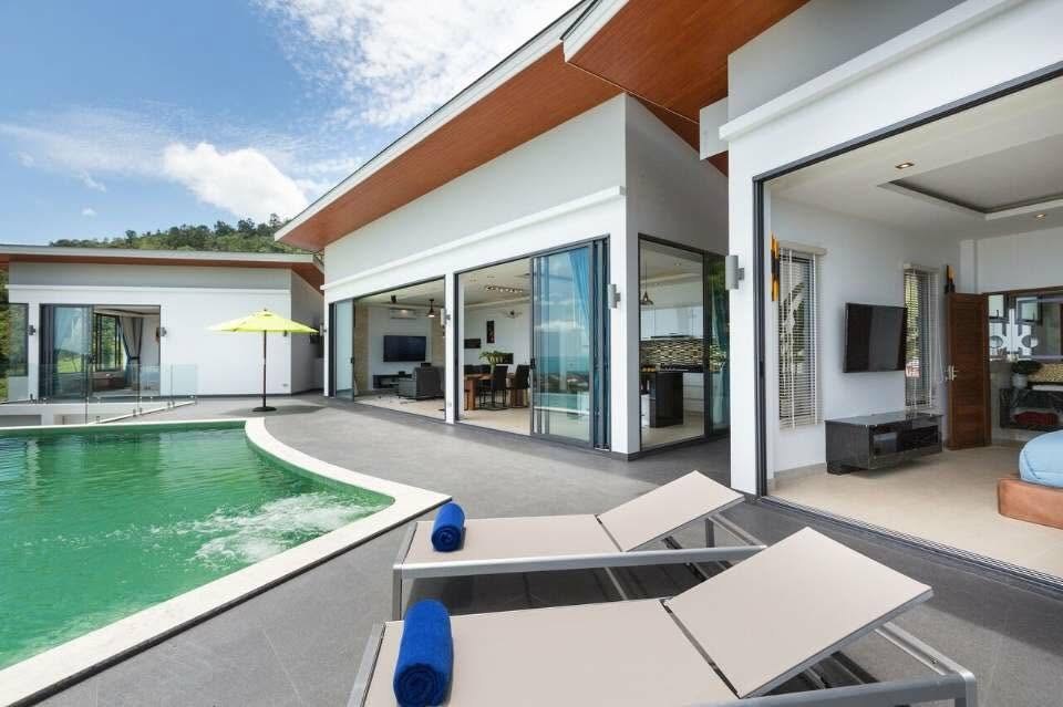 Exterior pool deck and sun loungers at Victoria, daytime