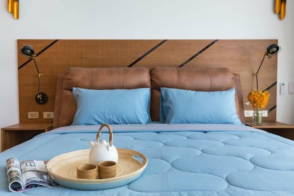 Bedroom interior with leather headboard, Victoria